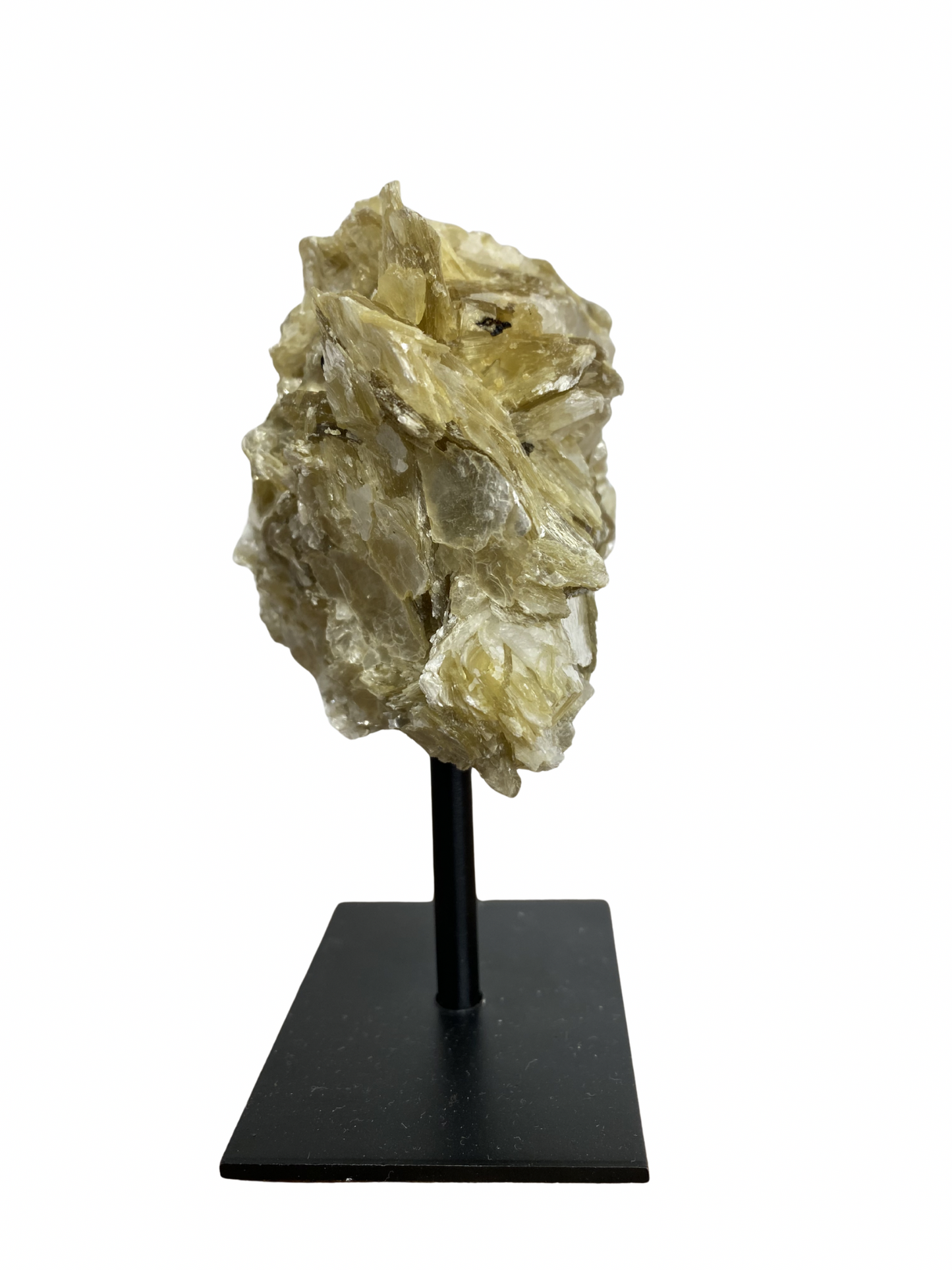 Raw Fuchsite sculpture on a stand