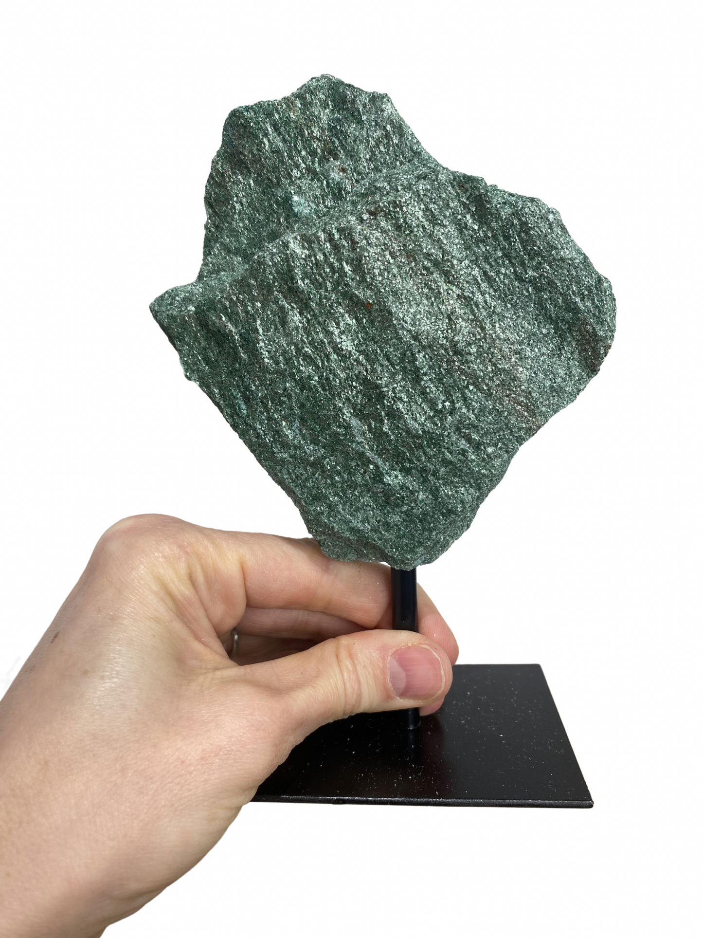 Raw Fuchsite sculpture on a stand