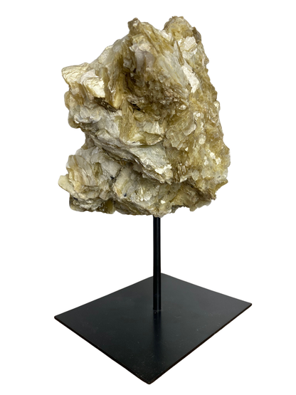 Raw Fuchsite sculpture on a stand