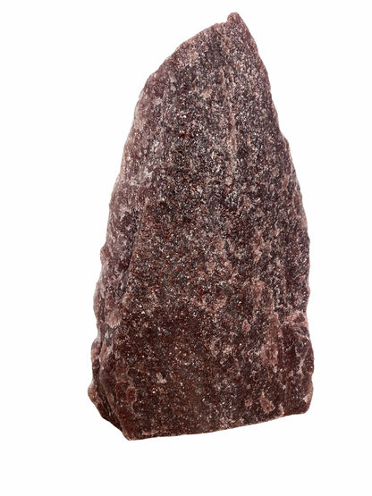 Raw Fuchsite sculpture on a stand