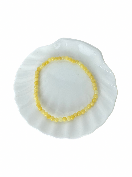 Oranje (Gele) Calciet kogelarmband 4 mm