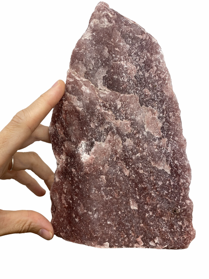 Raw Fuchsite sculpture on a stand