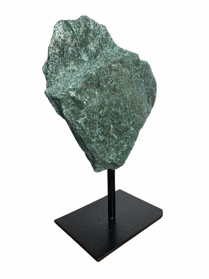 Raw Fuchsite sculpture on a stand
