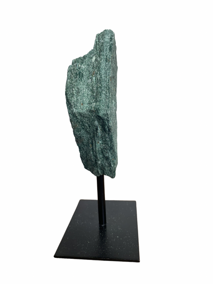 Raw Fuchsite sculpture on a stand