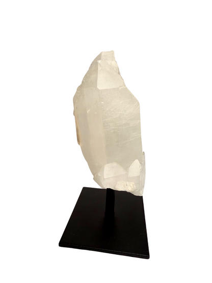 Raw rock crystal point on stand