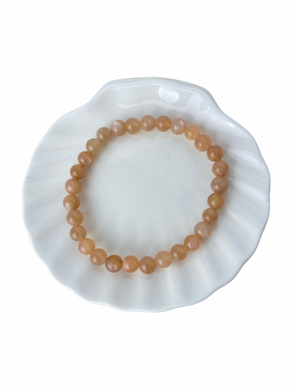 Maansteen (perzik) kogelarmband 6 mm